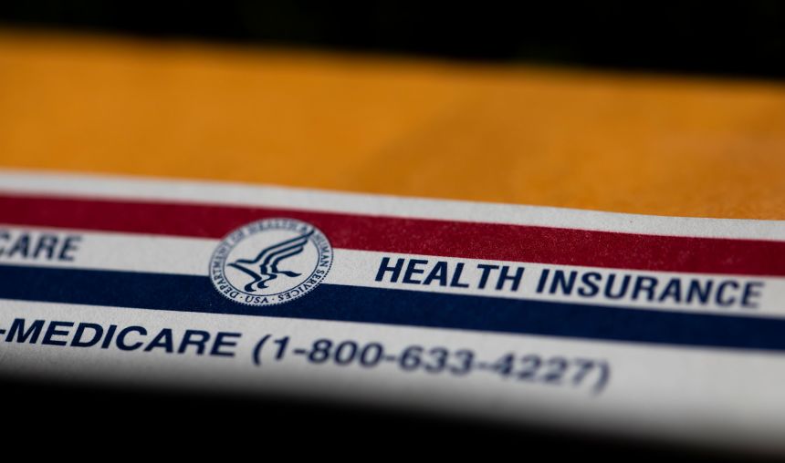 A shadow is seen across a Medicare card in Portland, Oregon, on June 10, 2024.
