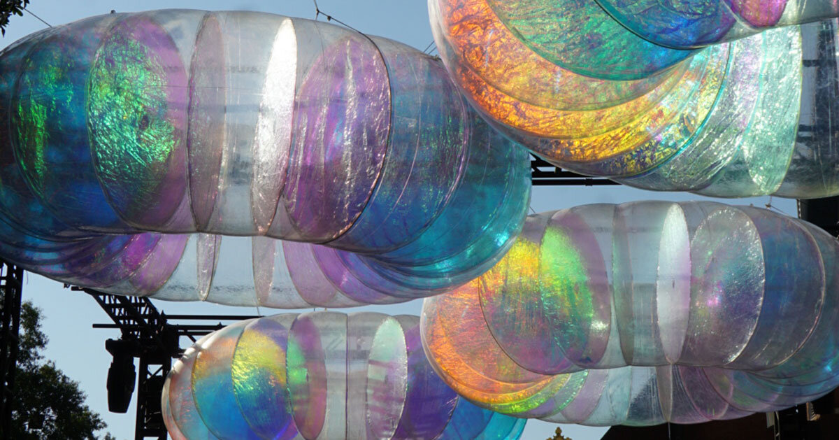 floating oculus installation shimmers in shifting chromatic light