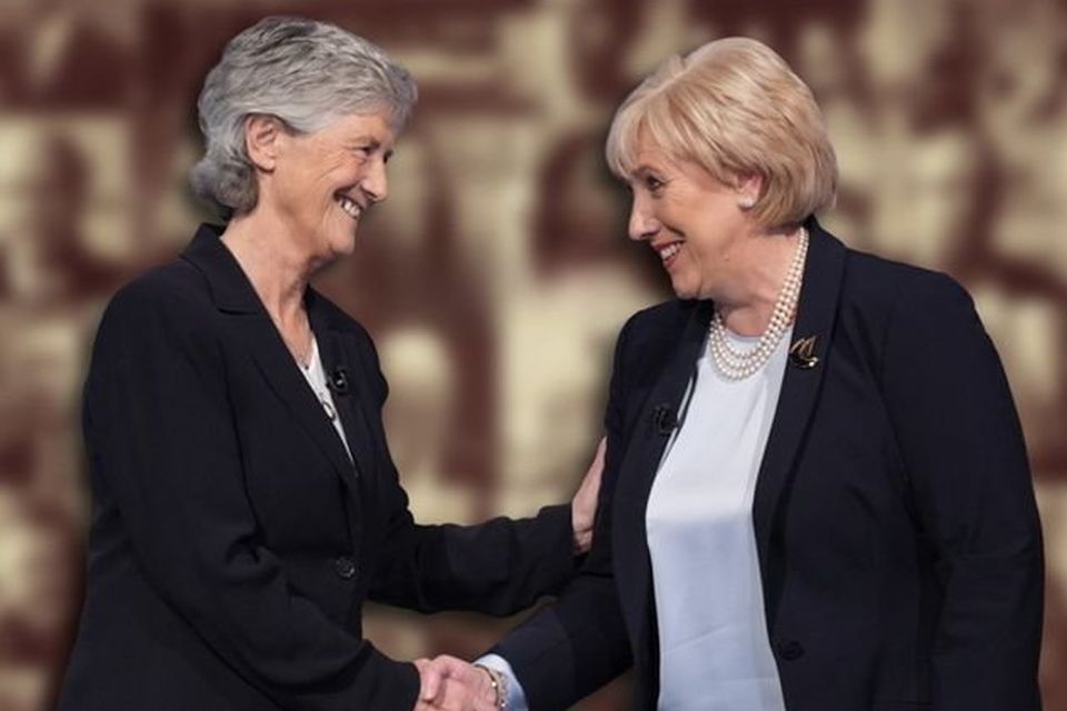 Catherine Connolly shakes hands with her presidential rival Heather Humphreys