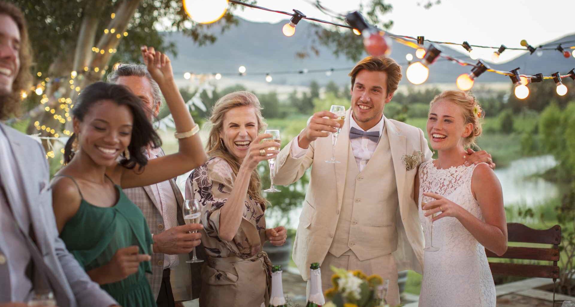 20-24 Years, 25-29 Years, 40-44 Years, 55-59 Years, African Ethnicity, Boho, Boho Wedding, Bride, Bridegroom, Bunting, Cape Town, Caucasian Ethnicity, Celebration, Celebratory Toast, Champagne, Champagne Flute, Chinese Ethnicity, Day, Decoration, Domestic Garden, Dress, Drink, Elegance, Fairy Lights, Flower, Glass, Guest, Happiness, Heterosexual Couple, Holding, Horizontal, Illuminated, Looking Away, Mature Adult, Mature Men, Mature Women, Medium Group Of People, Men, Mixed Race Person, Mountain, Multiethnic, Outdoors, Plate, Pond, Selective Focus, South Africa, Standing, Suit, Table, Togetherness, Tree, Vase, Wedding, Wedding Dress, Wedding Reception, Well-Dressed, White Wine, Wine Bottle, Wineglass, Women, Young Adult, Young Couple, Young Men, Young Women