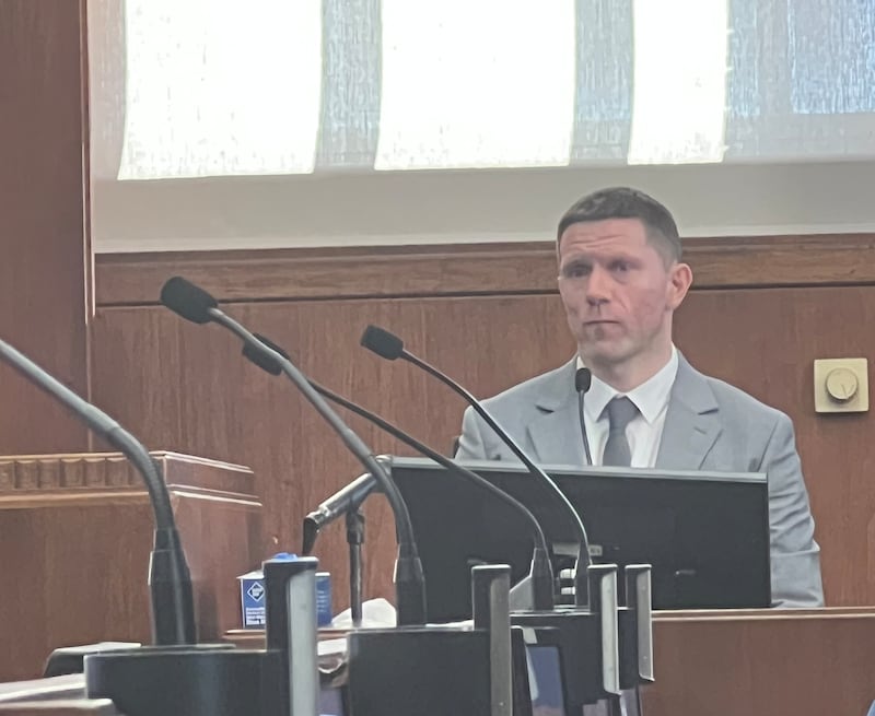 Crosbie takes the stand during the trial in Boston.