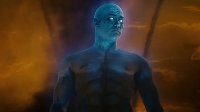 Billy Crudup's Jon Osterman / Doctor Manhattan is seen against an orange sky in Watchmen