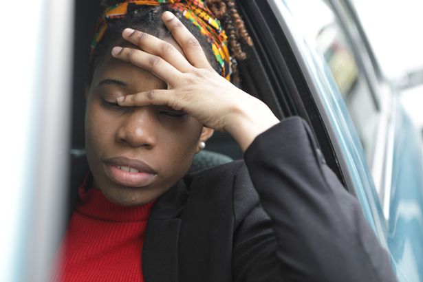 Woman stressed in car