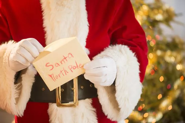 Santa holds letter