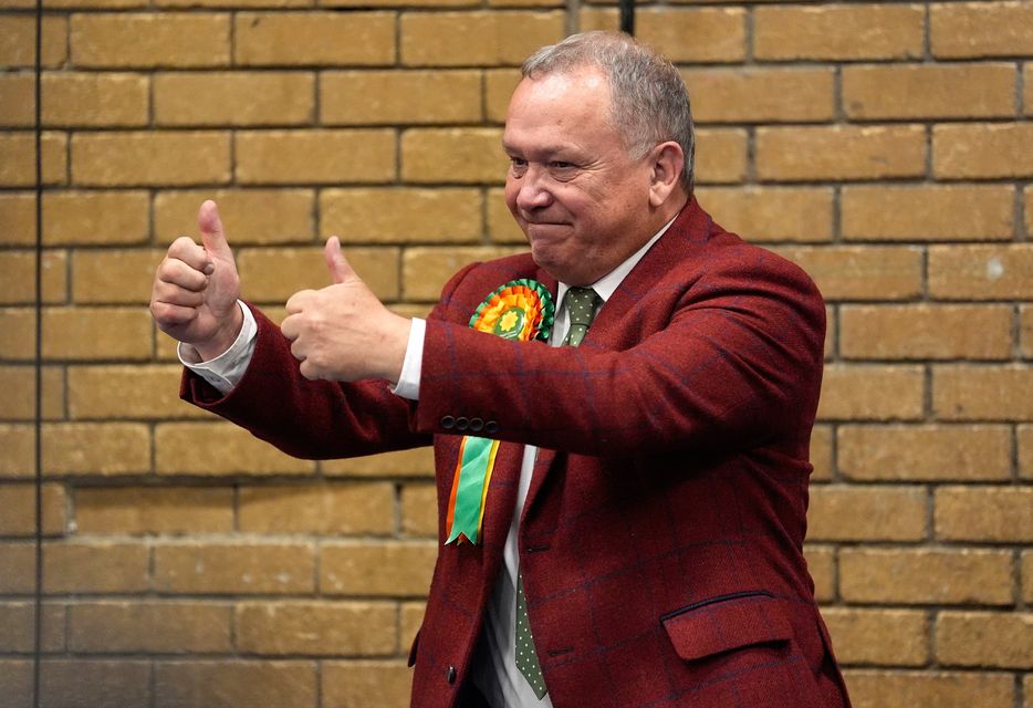 Plaid Cymru's Lindsay Whittle celebrates after being declared winner for the Caerphilly Senedd by-election, at Caerphilly Leisure Centre. Andrew Matthews/PA Wire