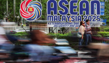 People take photos next to the ASEAN logo ahead of the 47th ASEAN Summit in Kuala Lumpur, Malaysia, on Oct. 24, 2025.