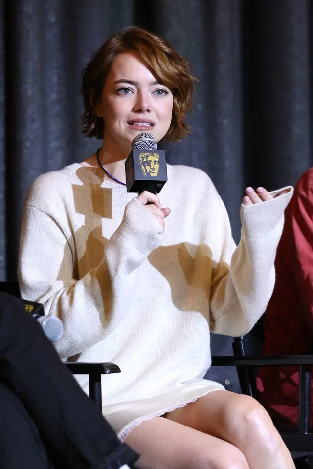 Getty She paired the sweater with a tiny white miniskirt