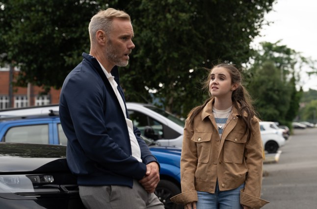 April speaks to Ray in Emmerdale in a car park