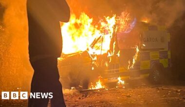 Police van set on fire at protest outside asylum seeker hotel