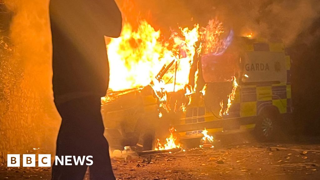 Police van set on fire at protest outside asylum seeker hotel