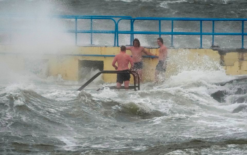 People on Blackrock diving tower in Salthill, Galway on Friday October 3, 2025. PA Photo. Photo: Brian Lawless/PA Wire