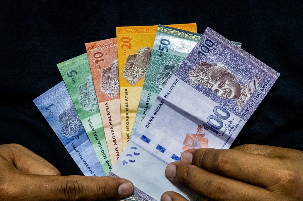 How much will you add into your EPF savings today? — Picture by Firdaus Latif