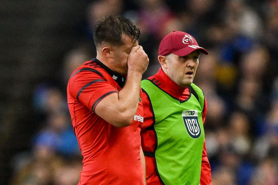 Brian Gleeson of Munster leaves the pitch with an injury against Leinster