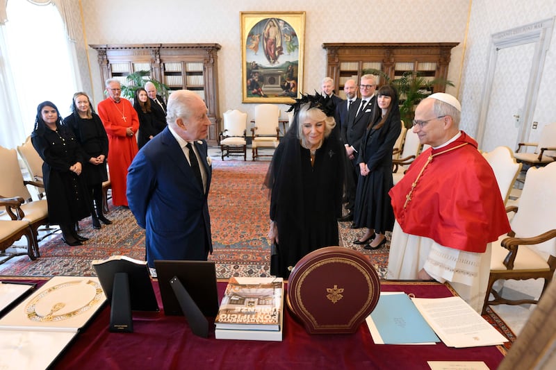 Pope Leo XVI exchanges gifts with King Charles and Queen Camilla during an audience at the Apostolic Palace. Photograph: Simone Risoluti/Vatican Media/Getty Images