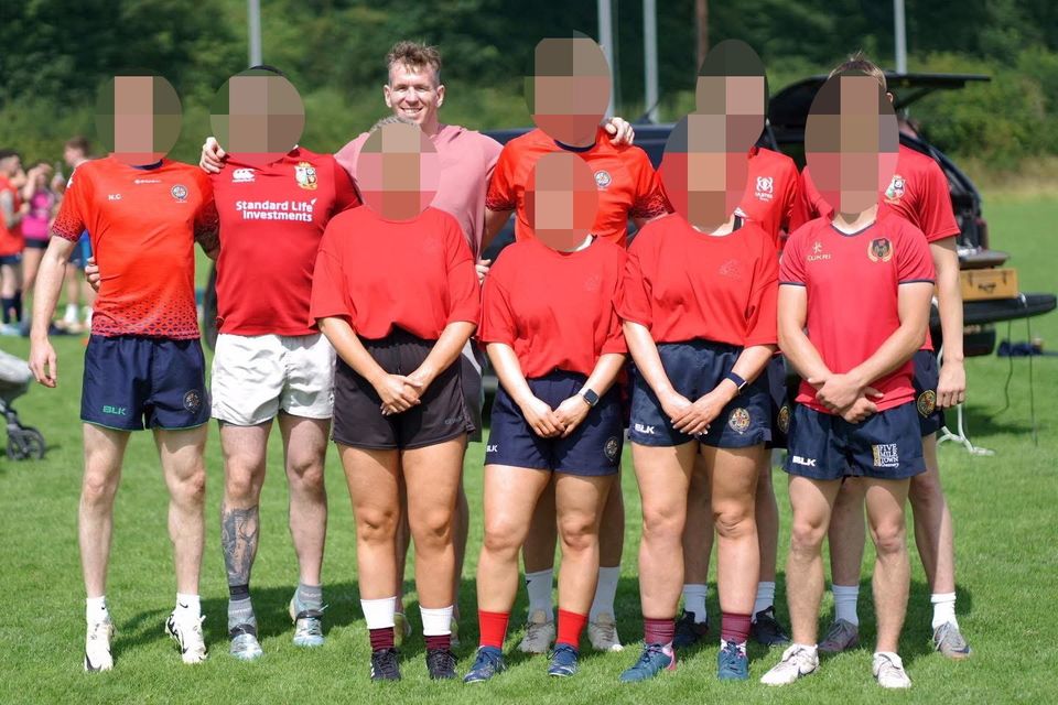 Farrell poses for a photo with a team at the tournament