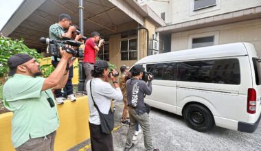 Facing the law: Media personnel approaching the van carrying the 14-year-old accused as it arrives at the Petaling Jaya Court Complex. — LOW BOON TAT/The Star
