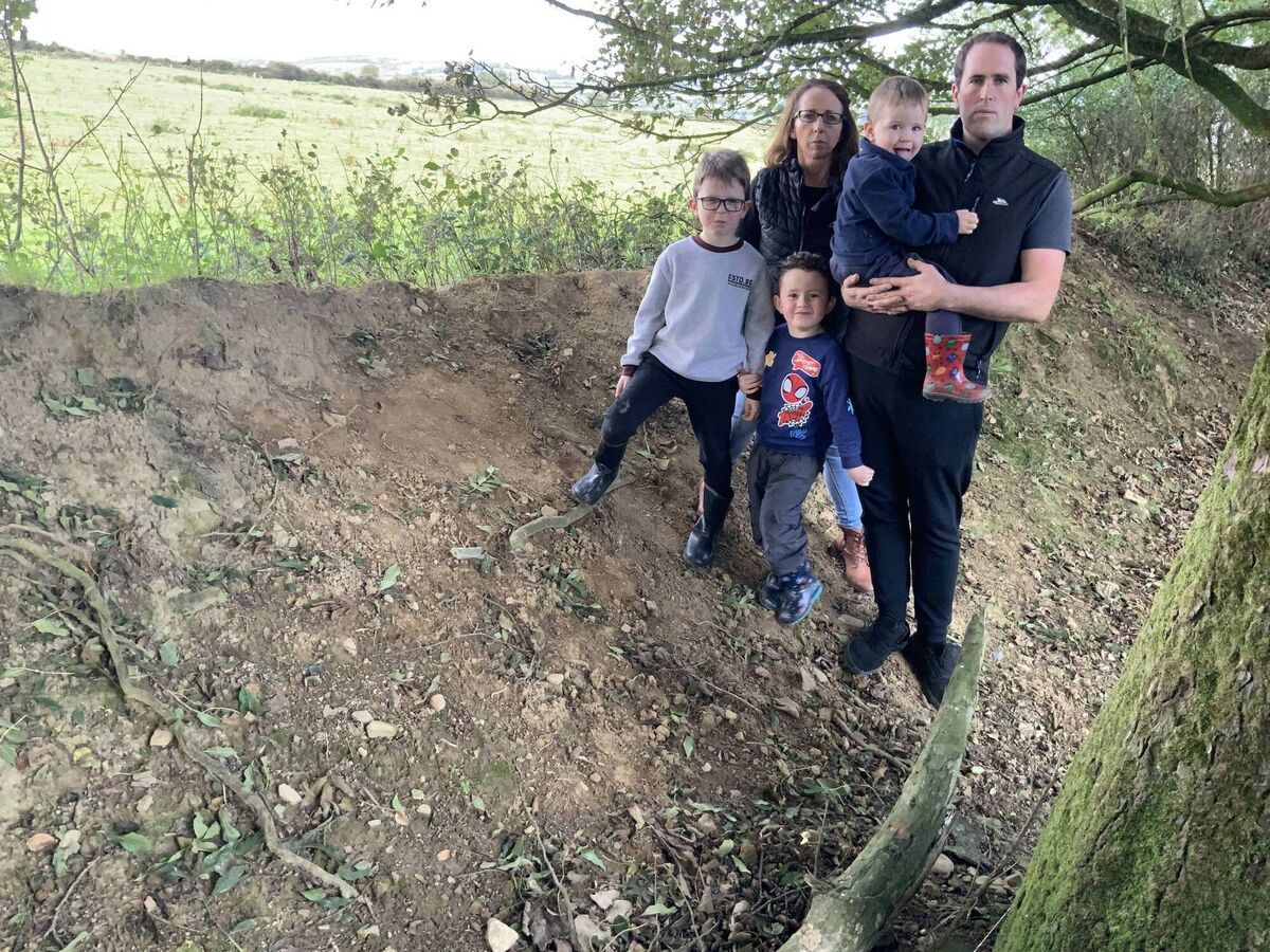 Con O'Connor and Maura Cronin O'Connor with their three sons looking over their ditch to the site of a proposed battery energy storage system at Curraduff, Glenlara, Newmarket, Co Cork.  
