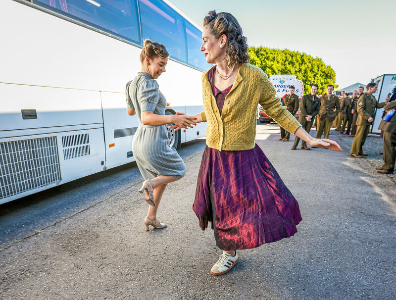 Professional dancer Jenny Murphy, left, originally from Bishopstown, Cork, but now living in London, and swinger dancer Maria Alvarez practising before filming, watched by other extras. 