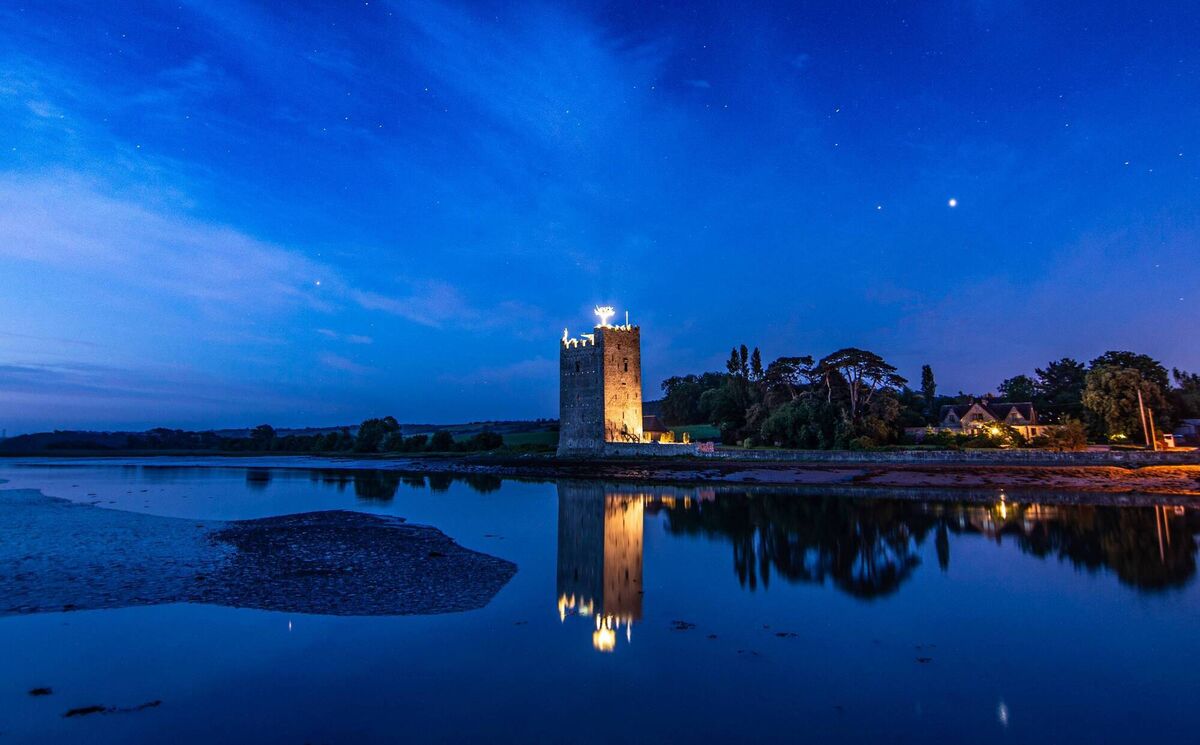 Mars, Saturn and Jupiter (identifiable as the three bright 'stars' from left to right in this image) shining brightly over Belvelly Castle before dawn. Picture: Cian O'Regan