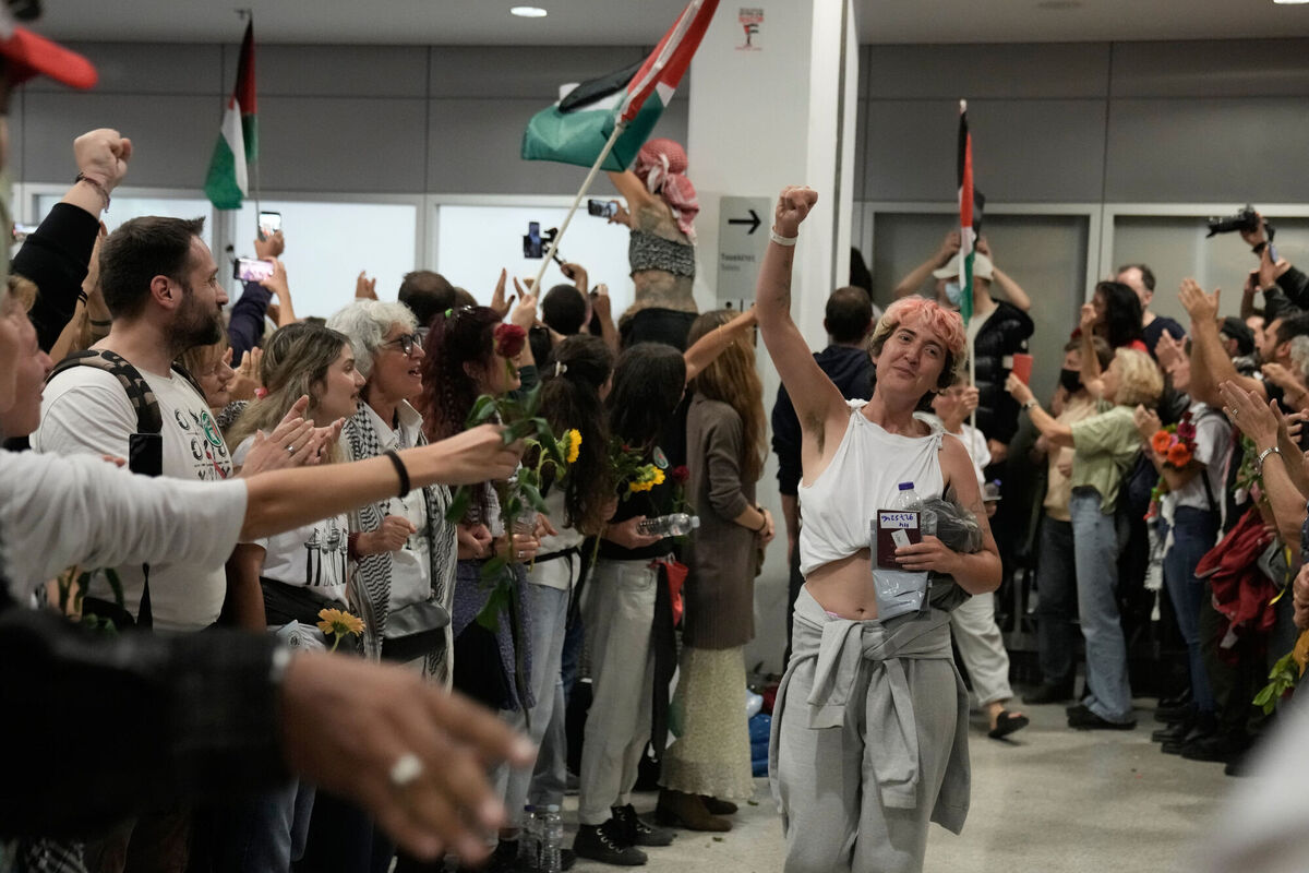 An activist arrives at the Eleftherios Venizelos International Airport in Athens, Monday, Oct. 6, 2025 after being deported from Israel for taking part in a Gaza-bound aid flottila. (AP Photo/Petros Giannakouris)