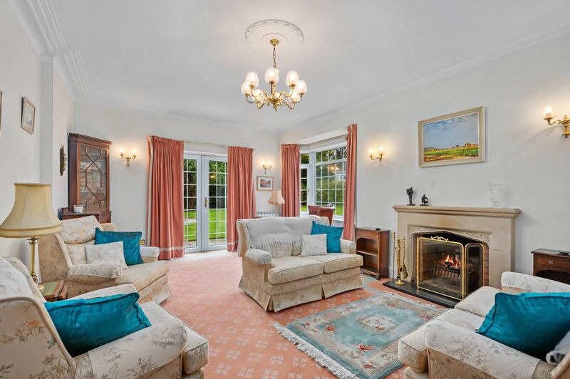 Main reception room with sandstone fireplace