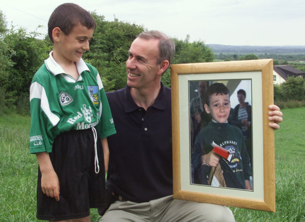 Yura Burmantau, 8, from Chernobyl with 'Irish Examiner' photographer Kieran Clancy presenting him with a framed photo of himself  in 2001.