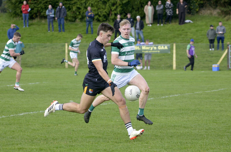 Ciarán Santry of Carbery Rangers gets his shot away, under pressure from Valley Rovers' David Muckian. Picture: Denis Boyle