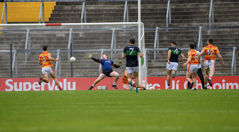  Nemo Rangers Kieran Histon puts the ball past Newcestown keeper Eoin McSweeney. Pic: Dan Linehan