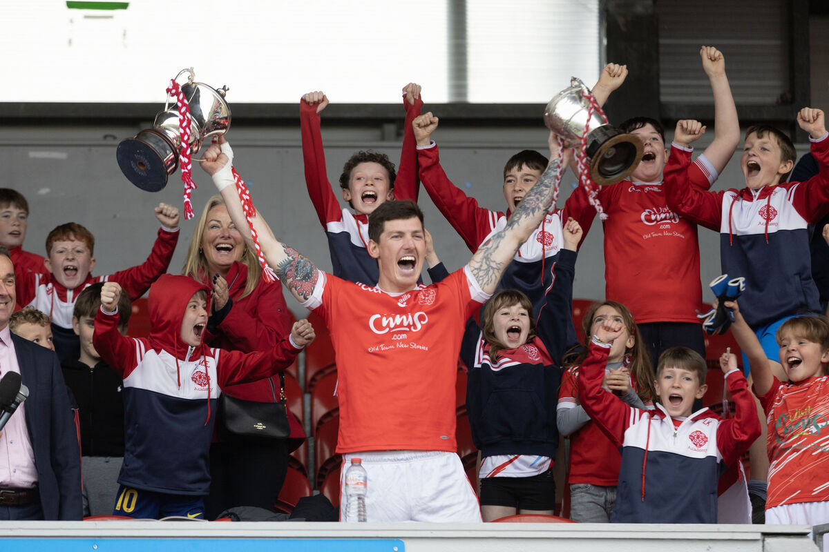  ON THE DOUBLE: Eire Og's Aaron Fitzgerald lifts the Jack Daly and the Canon Hamilton Cups. Picture: Eamon Ward