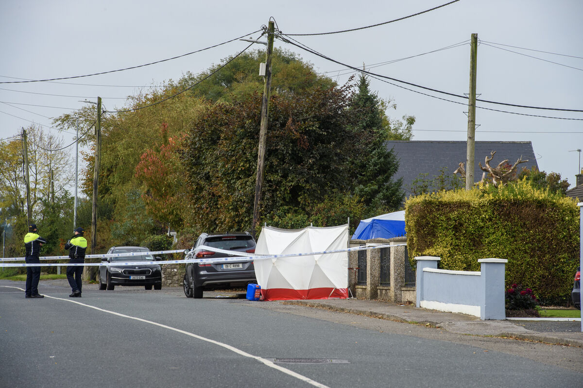  Gardaí at the cordoned-off scene following the discovery of the man’s body at Rockview Terrace, Doneraile, early on Sunday morning. Picture: Dan Linehan