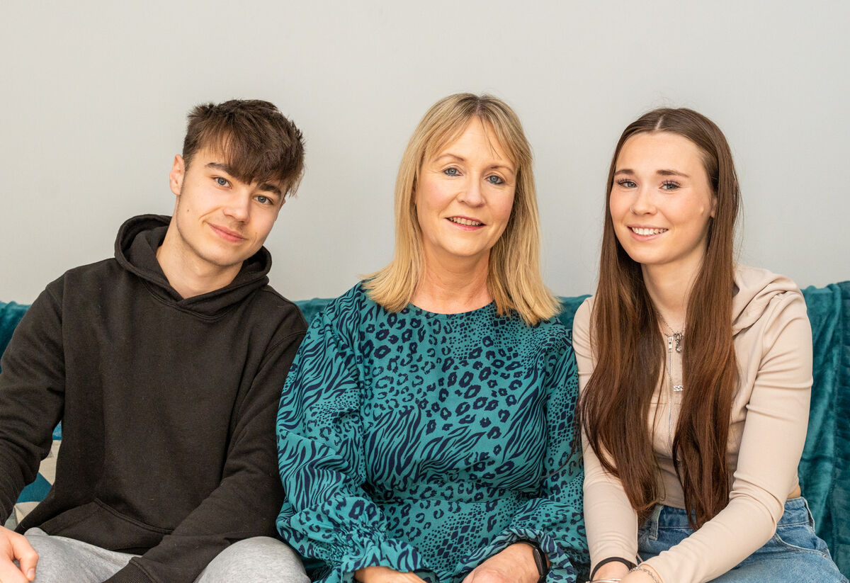 Karen Murray (centre) who has recovered from breast cancer with her son and daughter Calum and Niamh Funnell. Pic: Noel Sweeney
