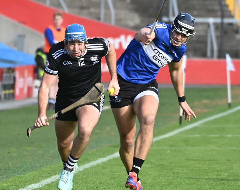 Midleton's Killian McDermott breaks from Sarsfields' Luke Elliott. Picture: Eddie O'Hare