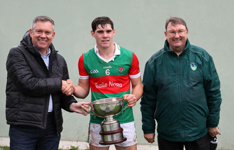  Bryan O'Donovan, MJK Oils presents the Cup to Shane Kingston, Ballinora, also included is John Feeney, Muskerry Chairperson.  2025 Muskerry Junior A Hurling Championship Final, Ballinora V's Grenagh, at Coachford, Co. Cork. 