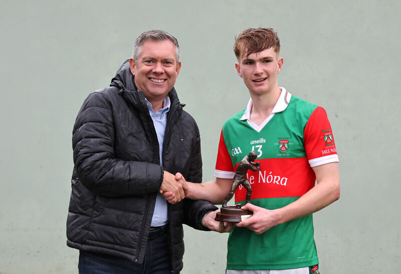  Bryan O'Donovan, MJK Oils presents the Player of the Match trophy to Ben Mayer, Ballinora. 2025 Muskerry Junior A Hurling Championship Final, Ballinora V's Grenagh, at Coachford, Co. Cork. 