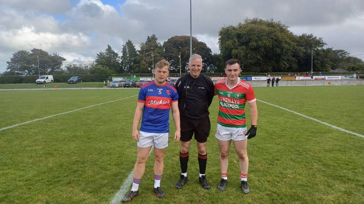 Erin's Own captain Ronan Blackton and Carraig na bhFear captain Tadhg O'Donoghue before the East Cork JAFC group game in Glenville, with referee Willie Wallace.