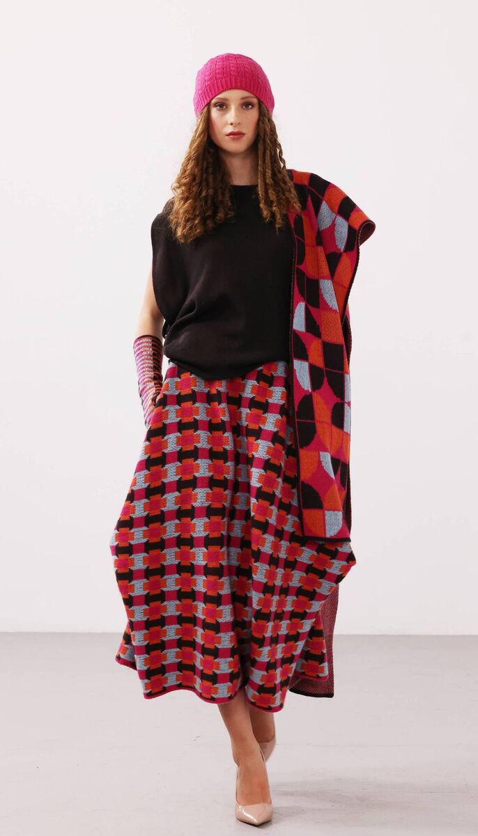 Milly top in brown €150, Calli draped skirt€280, Beanie cable hat 50, Indie handwarmers €50,Fragments scarf €75 Milly top in brown €150, Calli draped skirt€280, Beanie cable hat 50, Indie handwarmers €50,Fragments scarf €75