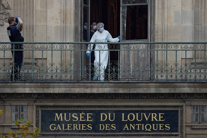 A French forensics officer examines the cut window of the gallery where the thieves broke in. Picture: Kiran Ridley/Getty Images A French forensics officer examines the cut window of the gallery where the thieves broke in. Picture: Kiran Ridley/Getty Images