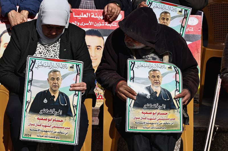 Demonstrators with placards bearing portraits of the director of the Kamal Adwan Hospital in Gaza, Hussam Abu Safiya, during a protest in solidarity with them in Ramallah city in the occupied West Bank last January. Photograph: Zain Jaafar/AFP via Getty Images        