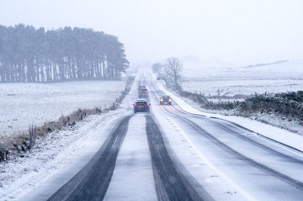 Traffic travels through snow along the A702 near Silverburn, Midlothian. 