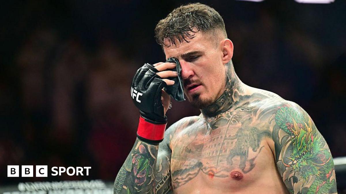Tom Aspinall holds his hurt eye at UFC 321