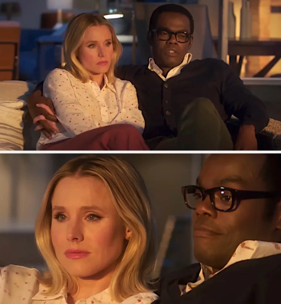 Two people sit closely on a sofa, watching a screen intently. They appear engaged and thoughtful