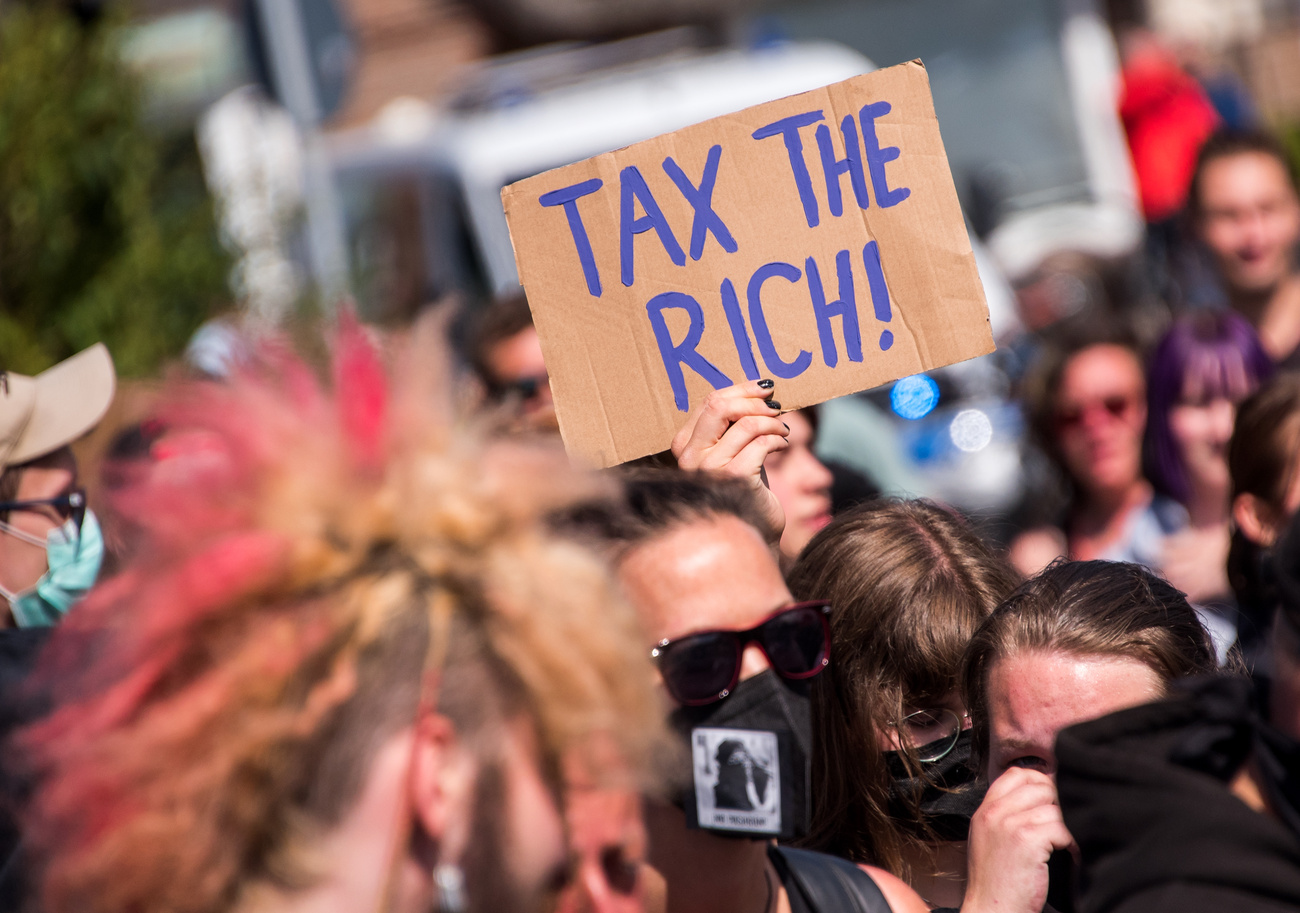 poster reading "tax the rich"