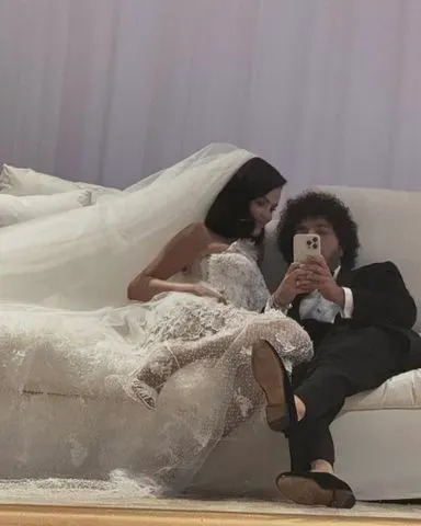 Instagram/@itsbennyblanco Selena Gomez wearing her second Ralph Lauren dress at her wedding to Benny Blanco.