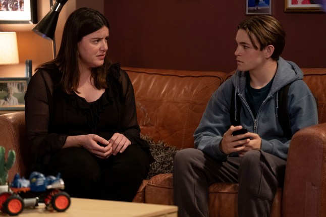 Zoe sits and speaks to Tommy in EastEnders