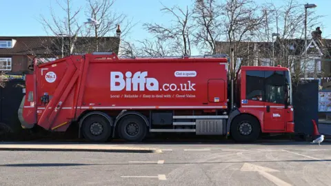 Getty Images A Biffa bin lorry - a large red truck with the word BIFFA in big letters down the side