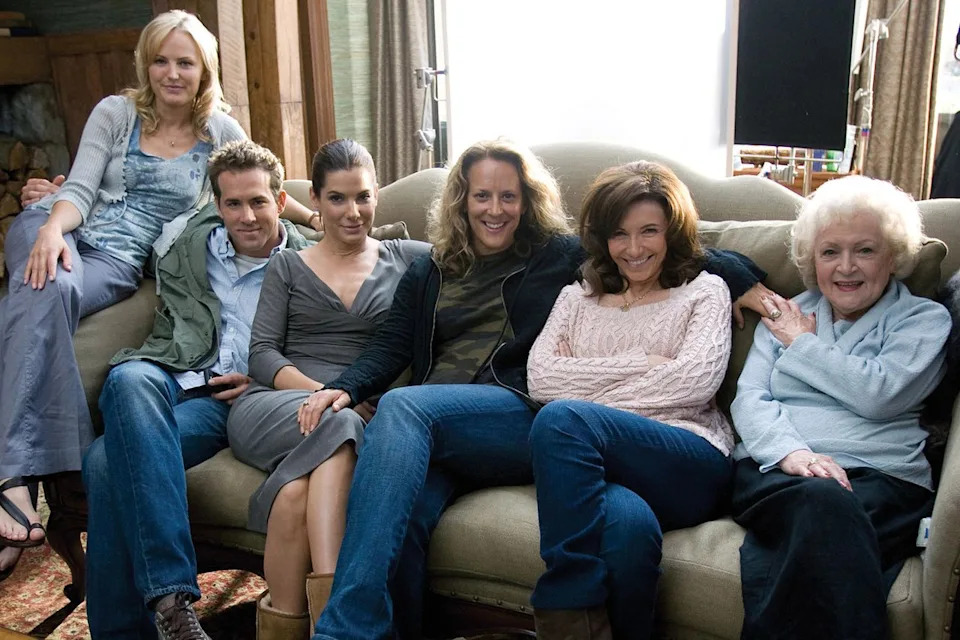 RGR Collection / Alamy From left: Malin Akerman, Ryan Reynolds, Sandra Bullock, Director Anne Fletcher, Mary Steenburgen and Betty White on the set of 'The Proposal'