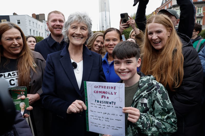 Connolly meets a young supporter, Joshua (10), on O'Connell Street on Sunday. Photograph: Conor O'Mearain/PA Wire 