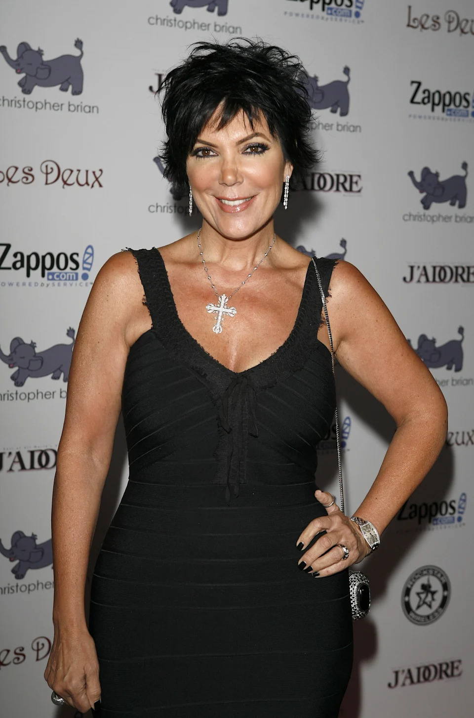 Kris Jenner is wearing a black dress on the red carpet