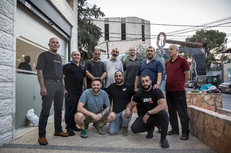 ACLAÍ Palestine gym founder Ainle Ó Cairealláin (left, front) with gym users in Aida refugee camp