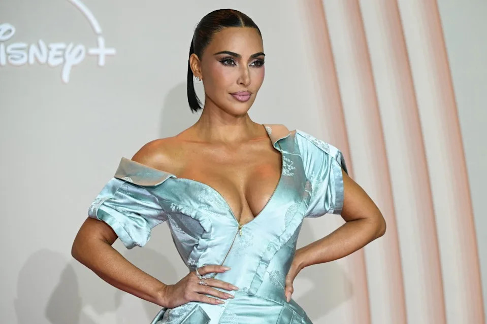 The birthday girl, 45, left the dress dramatically unzipped, showing off her bare décolletage and signature cleavage. AFP via Getty Images